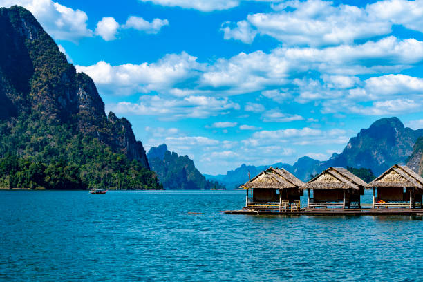 Khao Sok Lake National Park Khao Sok Lake National Park in Thailand. The lake is man made with a Dam and one end. The flooding of the valley has created an abundance of steep sided limestone islands. This is a floating village on the reservoir. kao sok national park stock pictures, royalty-free photos & images