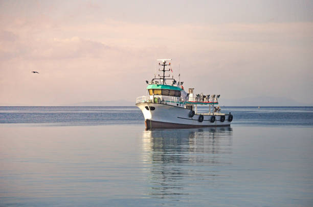 istock white clouds under a boat on blue sea 1144595230