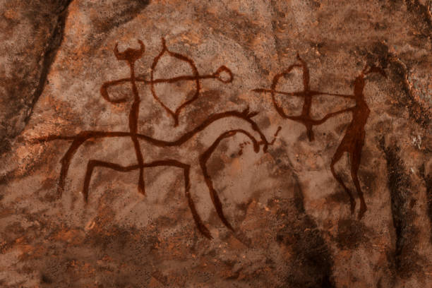iDrawing of ancient hunters on the wall of the cave. iDrawing of ancient hunters on the wall of the cave. history of antiquities, archaeology. cave painting photos stock pictures, royalty-free photos & images