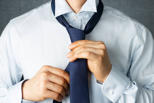 Male hands tie in hand on white background isolation