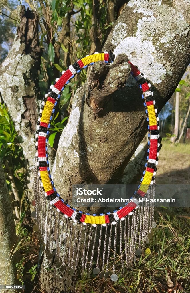 Masai necklace Masai necklace hanged on a tree as famouse colourful local accessories Africa Stock Photo