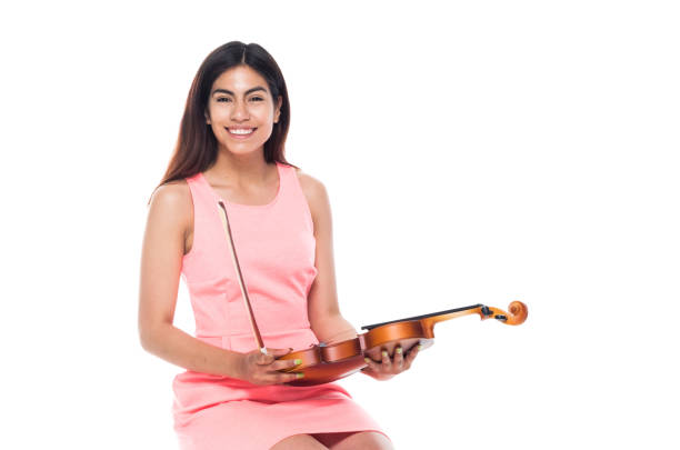 istock Cute female playing the voilin while sitting 1144601571