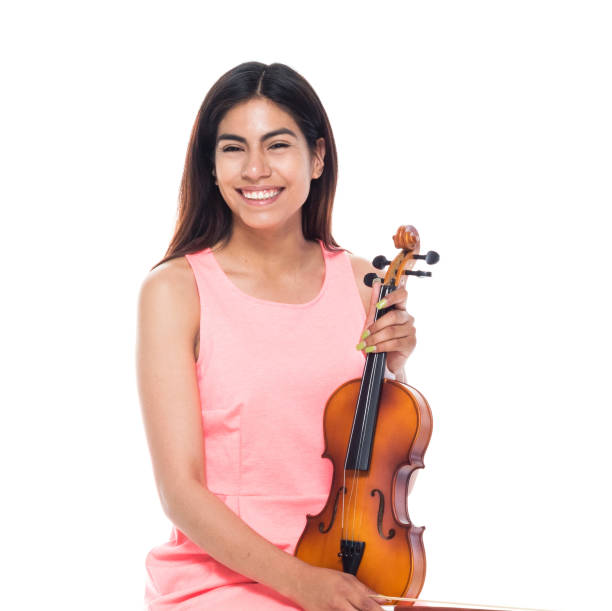 Cute female playing the voilin while sitting