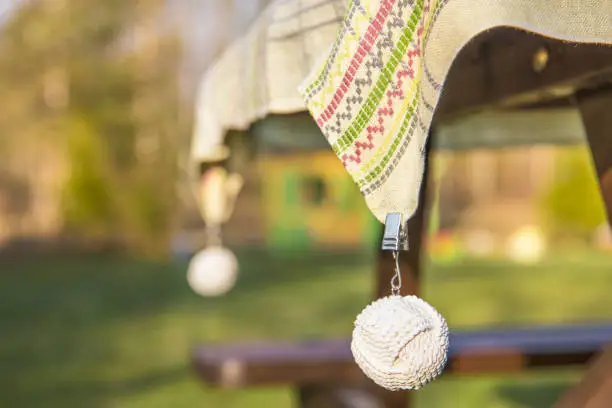 Photo of Clip tablecloth weights attached to a table cloth outdoors these are designed to hold your table cloth steady on windy day when you want to eat outside.