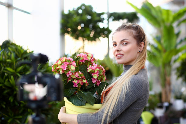istock Young beautiful woman holding a pot 1144602956