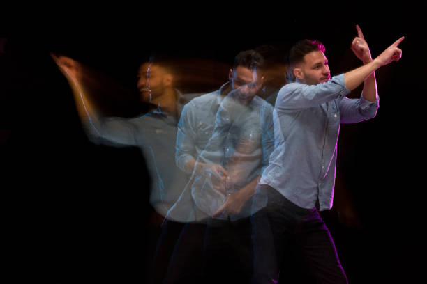 istock Handsome man in a blue shirt dancing 1144603078