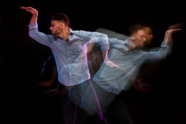 istock Handsome man in a blue shirt dancing 1144603100
