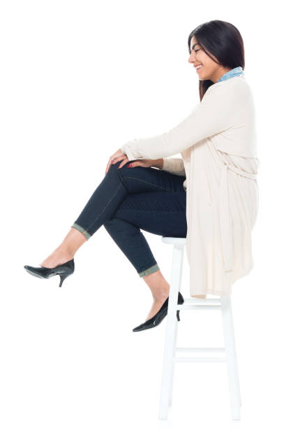 istock Attractive young latino female is sitting 1144604852