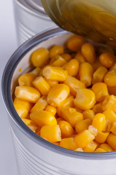istock Canned corn in a iron can on white background 1144609099