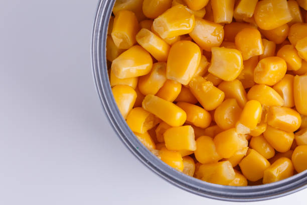 istock Canned corn in a iron can on white background 1144609104
