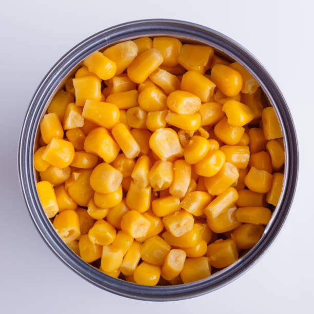 istock Canned corn in a iron can on white background 1144609109