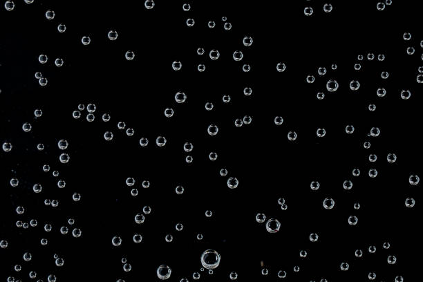 Air bubbles on black background stock photo