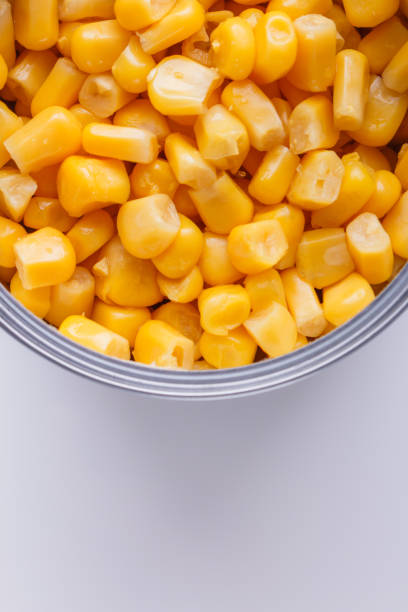 istock Canned corn in a iron can on white background 1144609249