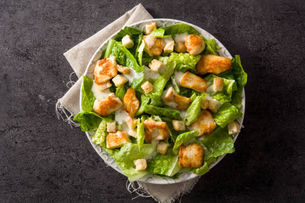 istock Caesar salad with lettuce,chicken and croutons 1144611923