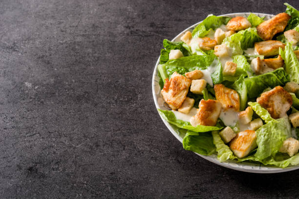 istock Caesar salad with lettuce,chicken and croutons 1144612021