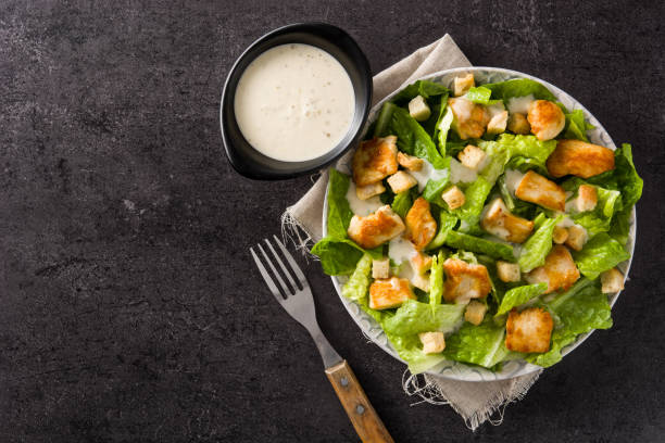 istock Caesar salad with lettuce,chicken and croutons 1144612065
