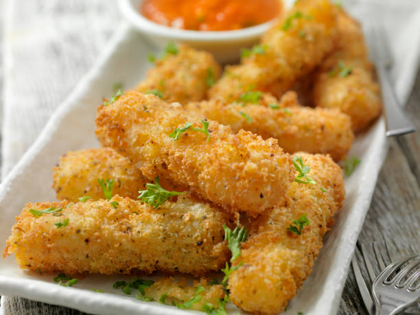 istock Breaded Cheddar Cheese Sticks with Marinara Dipping Sauce 1144612570