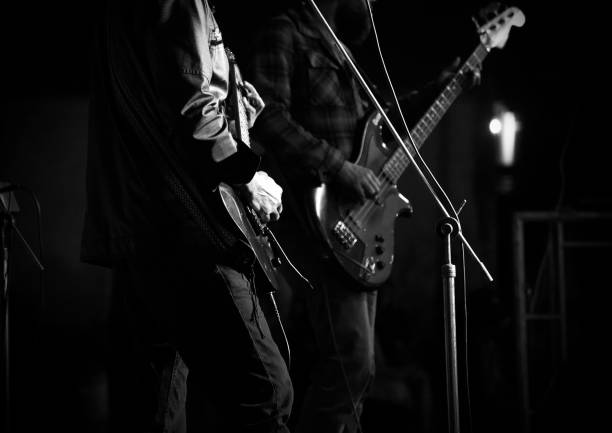 istock Men playing electric guitars in a concert 1144614045