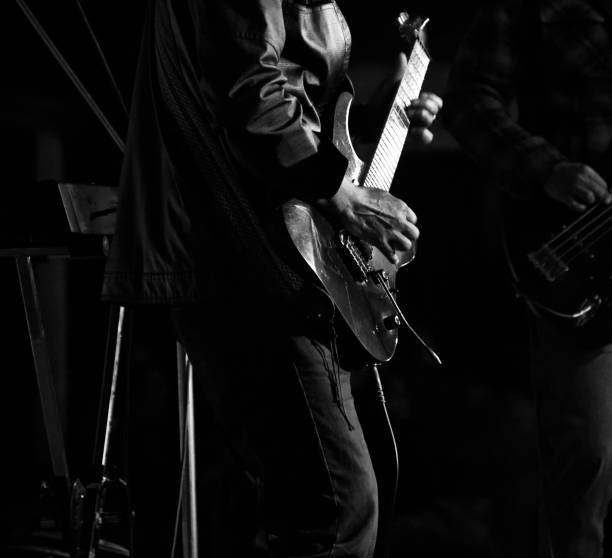 istock Men playing electric guitars in a concert 1144614064