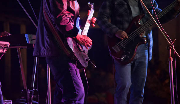 istock Men playing electric guitars in a concert 1144614092