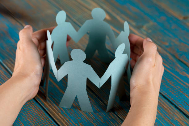 istock Hand Protecting Paper Cut Out Figure 1144614102