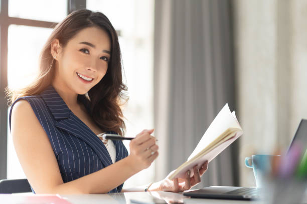 portrait female working at the office. - capital letter luxury blue image imagens e fotografias de stock