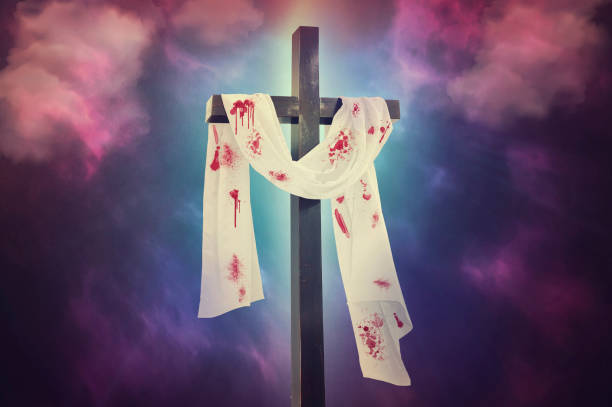 istock Cross against the cloudy sky 1144617786