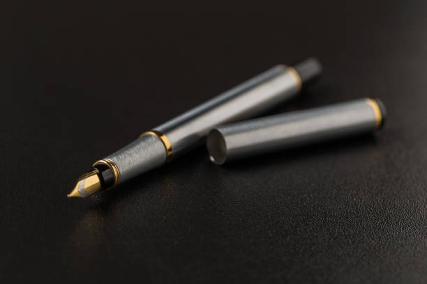 istock Fountain pen with clipping path on black background 1144619372