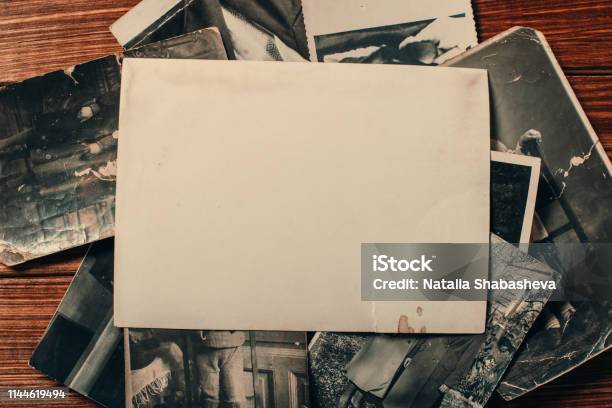 Stack Old Photos On Table Mockup Blank Paper Postcard Rumpled And Dirty Vintage Retro Card Stock Photo - Download Image Now