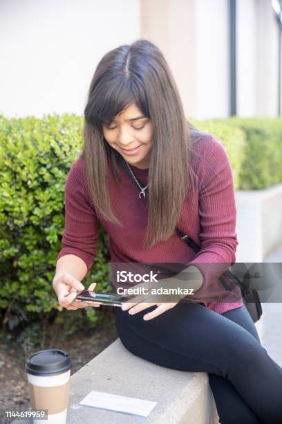 Woman Depositing Checks With Smartphone Stock Photo - Download Image Now - Check - Financial Item, Financial Bill, Banking