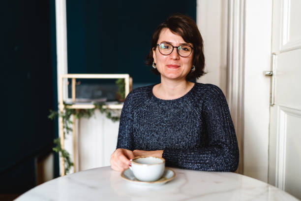 istock Happy Nice Lady Drinking Coffee in Cafe 1144621020
