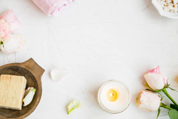 istock Spa still life with roses, towel, natural soap, candle top view with copy space, spa setting 1144621210