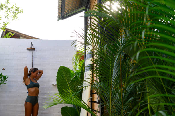 istock Using an outdoor shower after surfing 1144621527