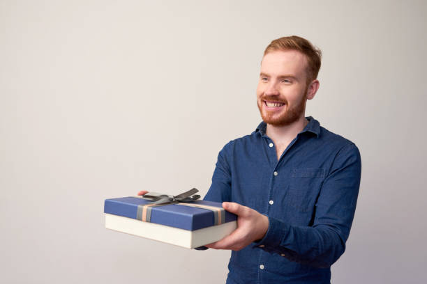 istock Man congratulating with holiday 1144623000