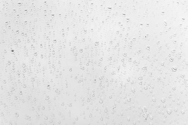 istock Water drops on glass white gray background. 1144623243