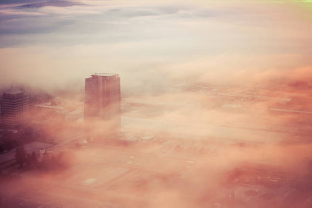 istock skyscraper rising above clouds in sunrise. 1144625943