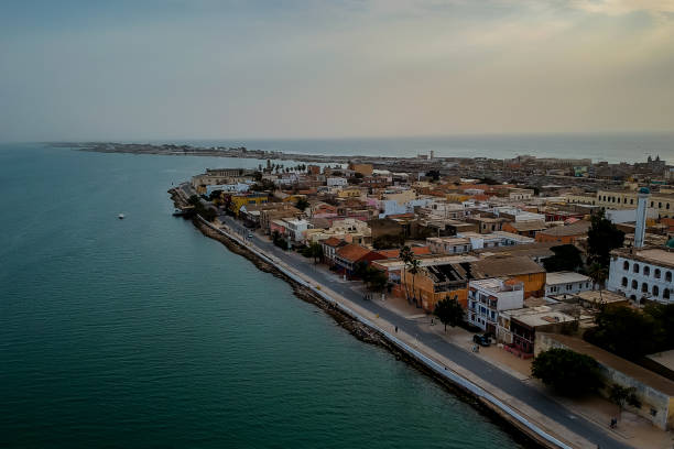 Aerial panorama of Sant Louis. Aerial panorama of Sant Louis, a unesco heritage city in northern Senegal. View from Senegal river towards the old colonial city and fisherman island. sénégal stock pictures, royalty-free photos & images