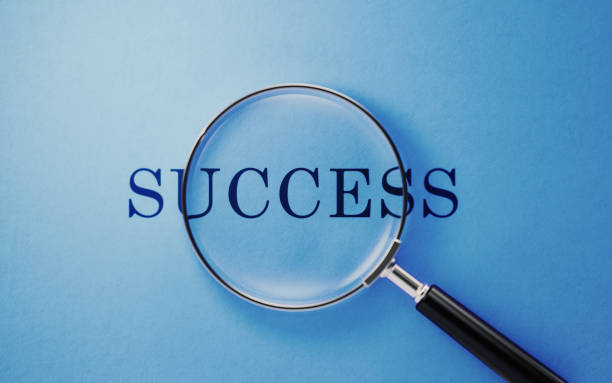istock Magnifier And Success Text On Blue Background 1144626443