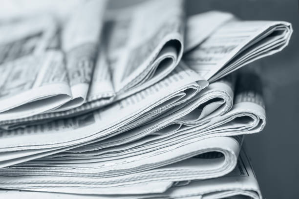 istock News concept, folded newspaper closeup. 1144628005
