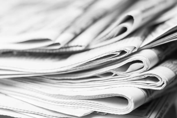 istock News concept, folded newspaper closeup. 1144628071