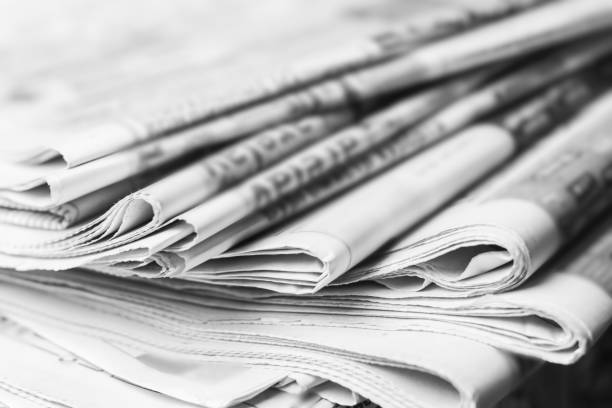 istock News concept, folded newspaper closeup. 1144628074