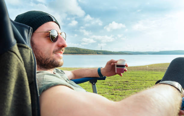 istock Man having picnic in nature 1144629427