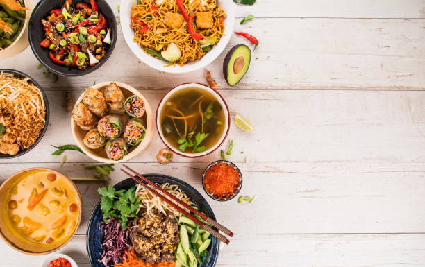 istock Asian food background with various ingredients on rustic wooden table. 1144630198