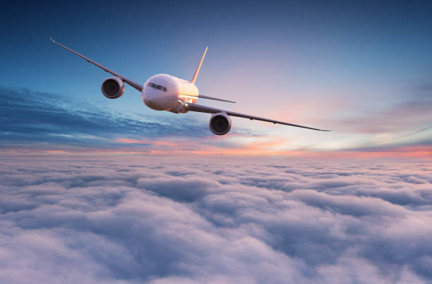 istock Commercial airplane jetliner flying above dramatic clouds. 1144630365