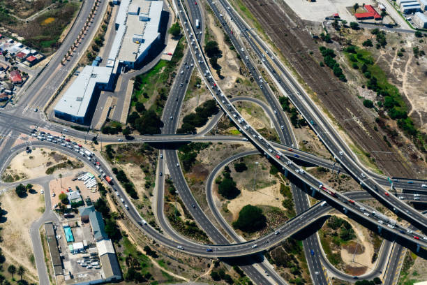 Highway intersection and aerial view car driving on a freeway overpass. Car traffic on highway bridge in Tehran