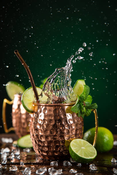 istock Famous splashing Moscow mule alcoholic cocktail in copper mugs. 1144631332