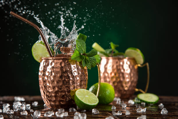 istock Famous splashing Moscow mule alcoholic cocktail in copper mugs. 1144631355