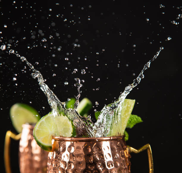 istock Famous splashing Moscow mule alcoholic cocktail in copper mugs. 1144631368