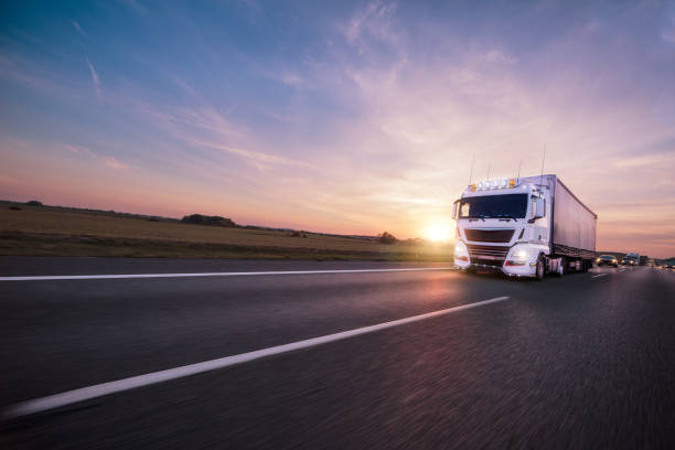 istock Truck with container on road, cargo transportation concept. 1144631524