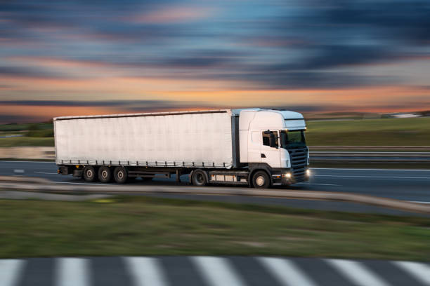 istock Truck with container on road, cargo transportation concept. 1144631529